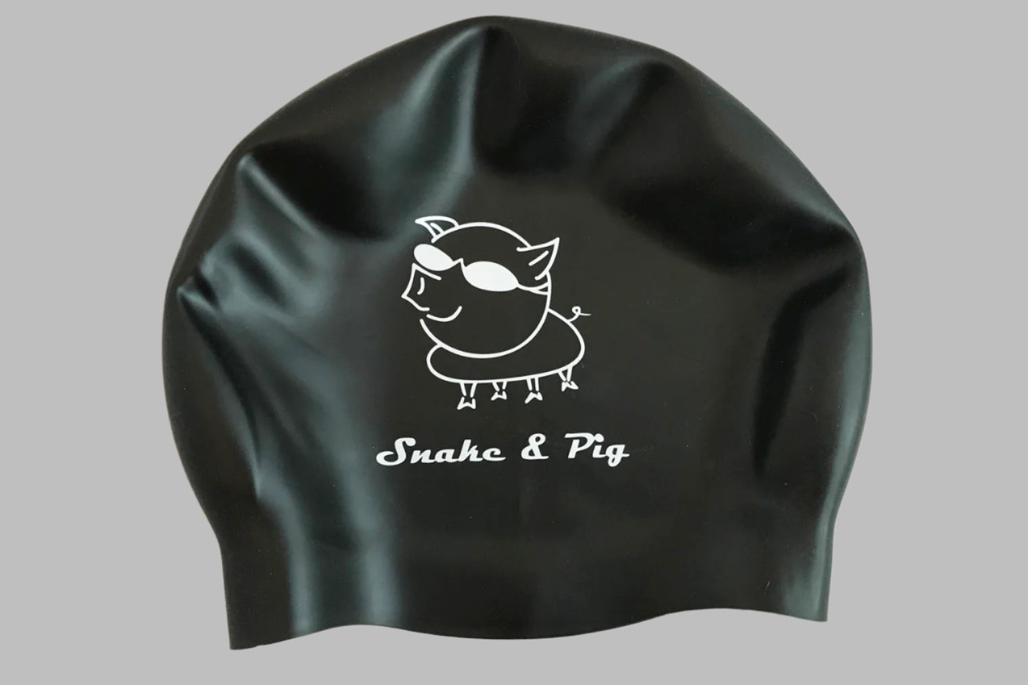 Black silicone cap with white print - a large pig with goggles and Snake & Pig underneath