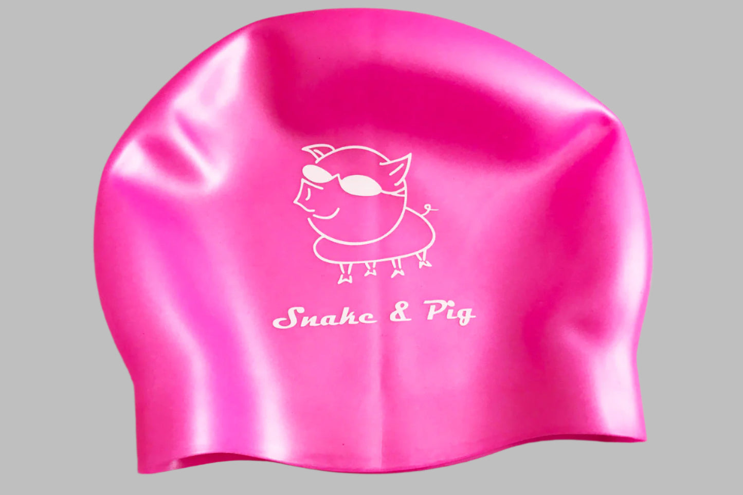 Pink silicone cap with Snake & Pig logo printed in white