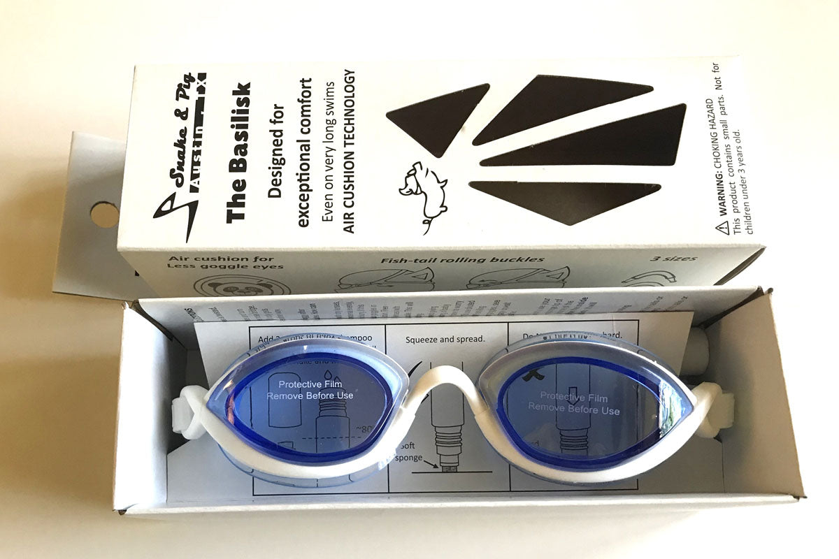 Snake and PIg goggles two-part recycled paper box with the two parts lying next to each other and blue tinted goggles inside