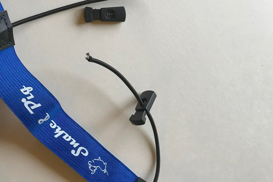 Close up of toggles that hold your race number in place