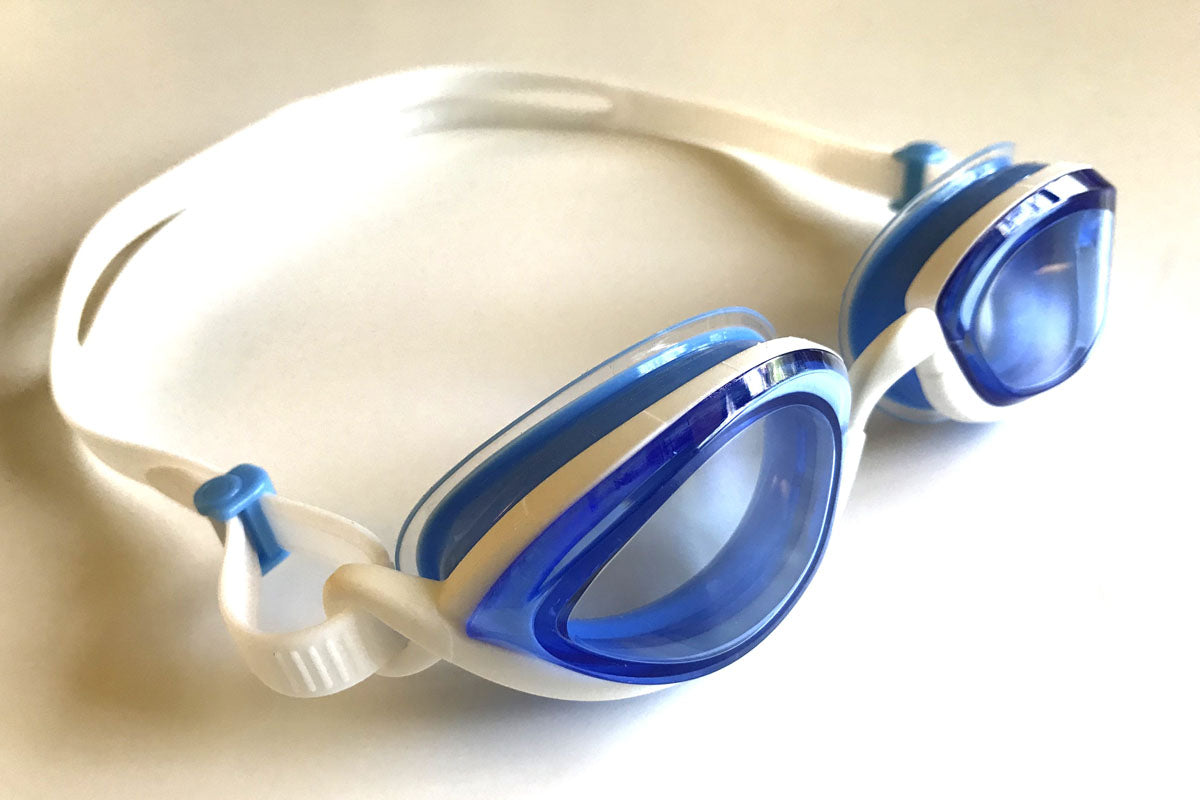 Snake & Pig Basilisk goggles with blue tint have white straps and blue air cushion gaskets