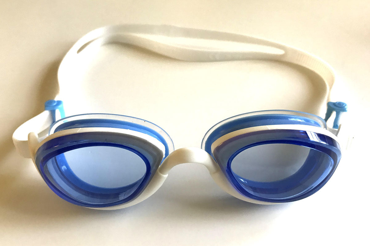 Snake & PIg Basilisk goggles with light blue lenses for indoor swimming as seen from the front
