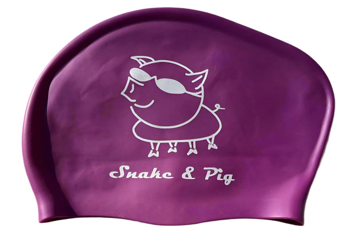 Purple long hair cap with white printed logo from Snake & Pig