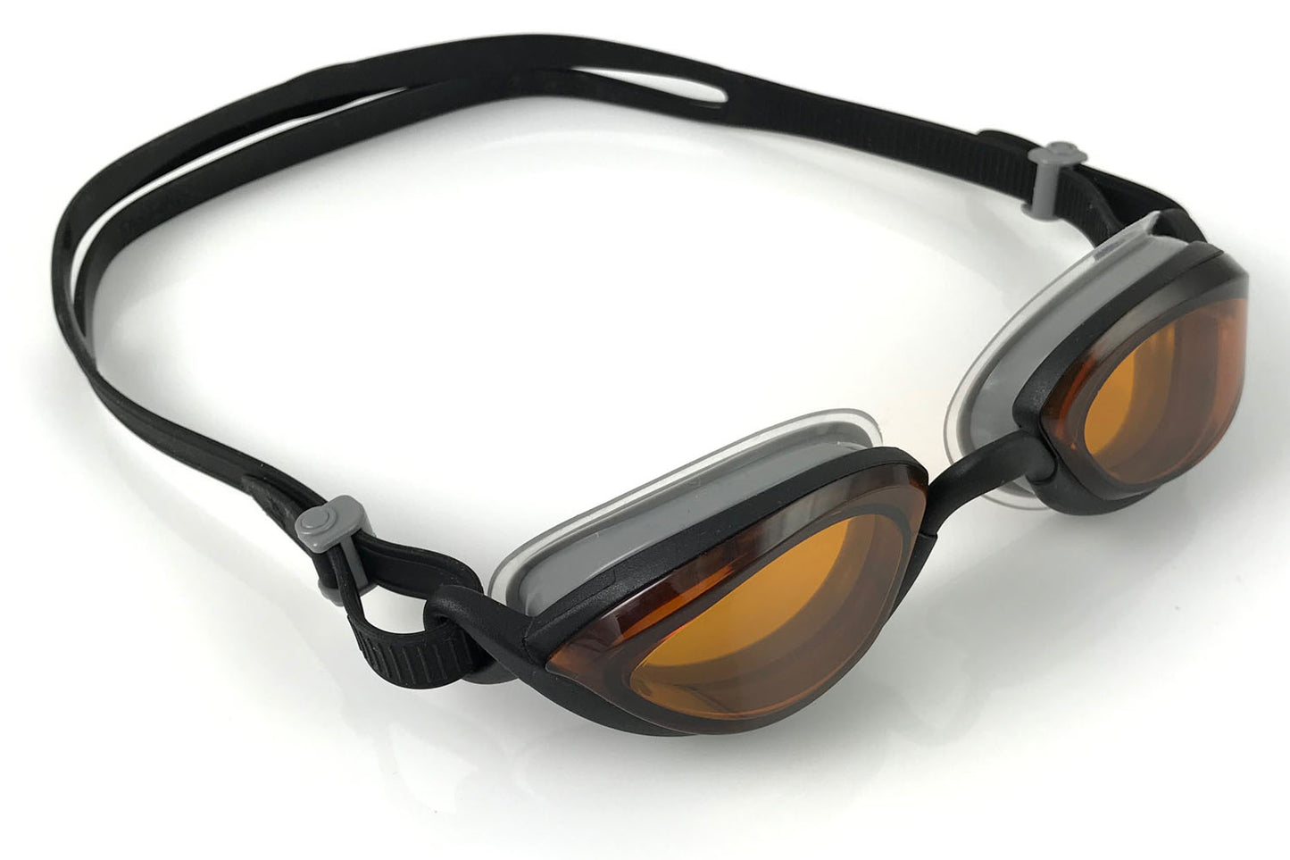 Side view of a pair of Basilisk goggles with black frames and strap, and amber lenses