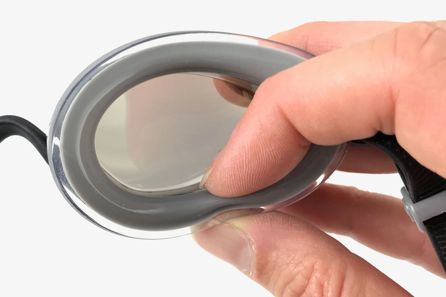 Fingers pinching the air cushion gasket showing that it is squishable.