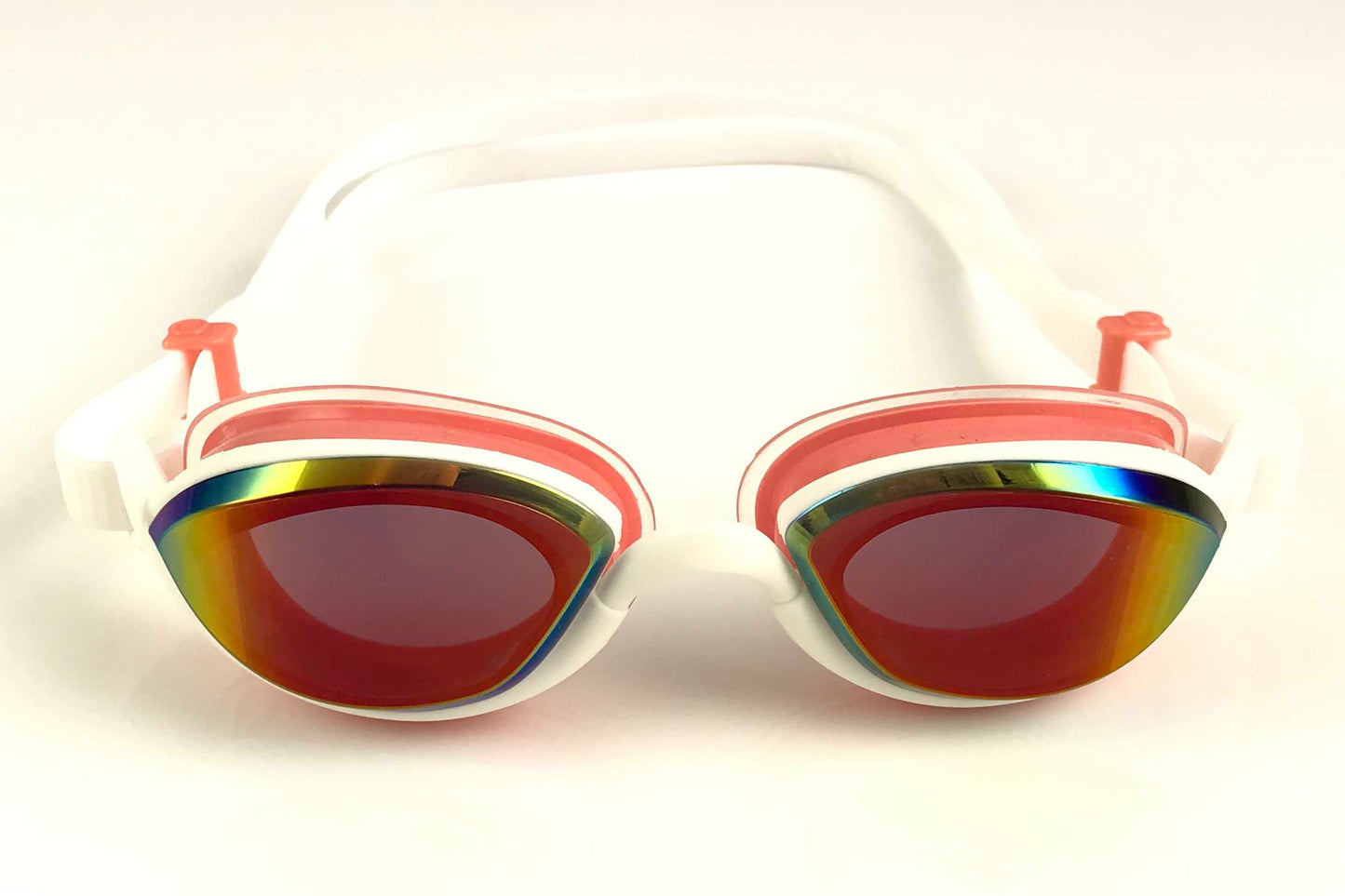 A pair of Snake and Pig Basilisk swimming goggles with pink gaskets and tinted lenses that have a rose-colored finish