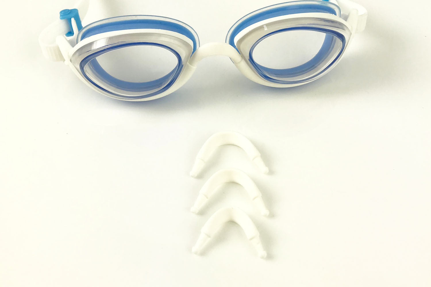 Blue clear goggles and the three sizes of nose bridges that come with them