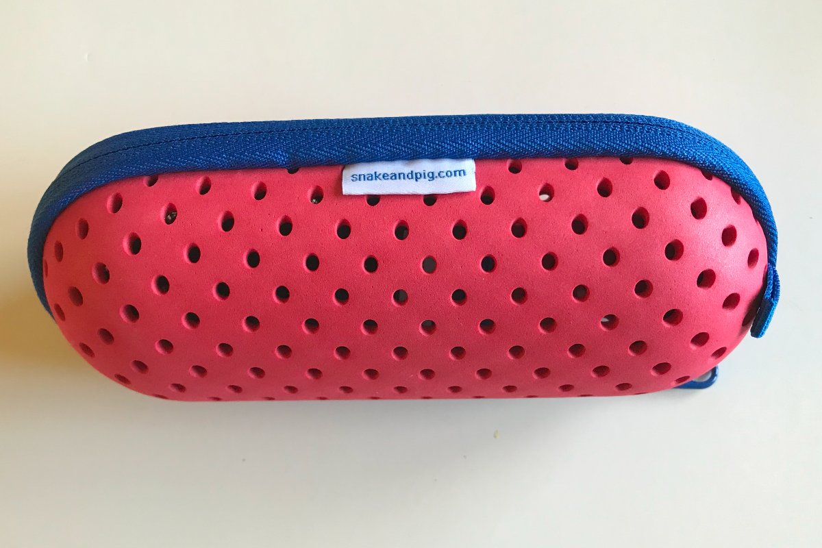 Pink foam swim goggle case with a royal blue zipper